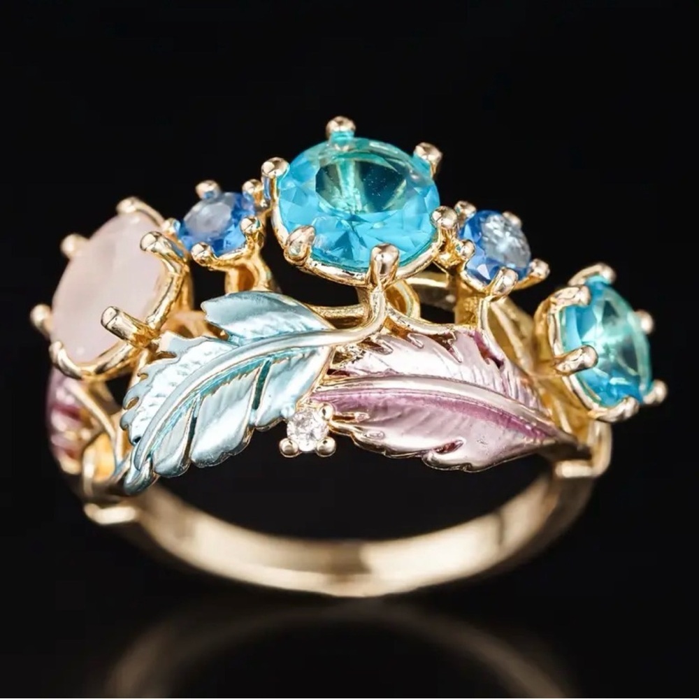 Gold Ring with Blue and Pink Accents.